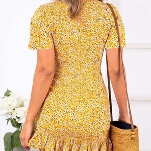 Yellow wrap dress with flowers.